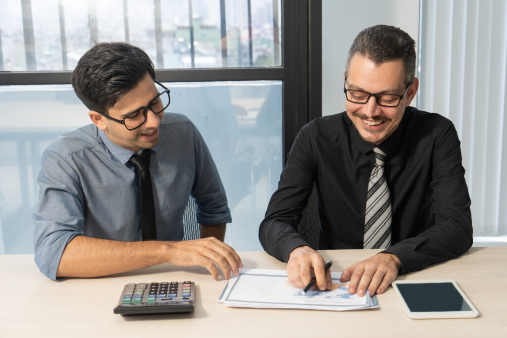 small business owner consulting a tax advisor for accurate ITR filing and tax planning.
