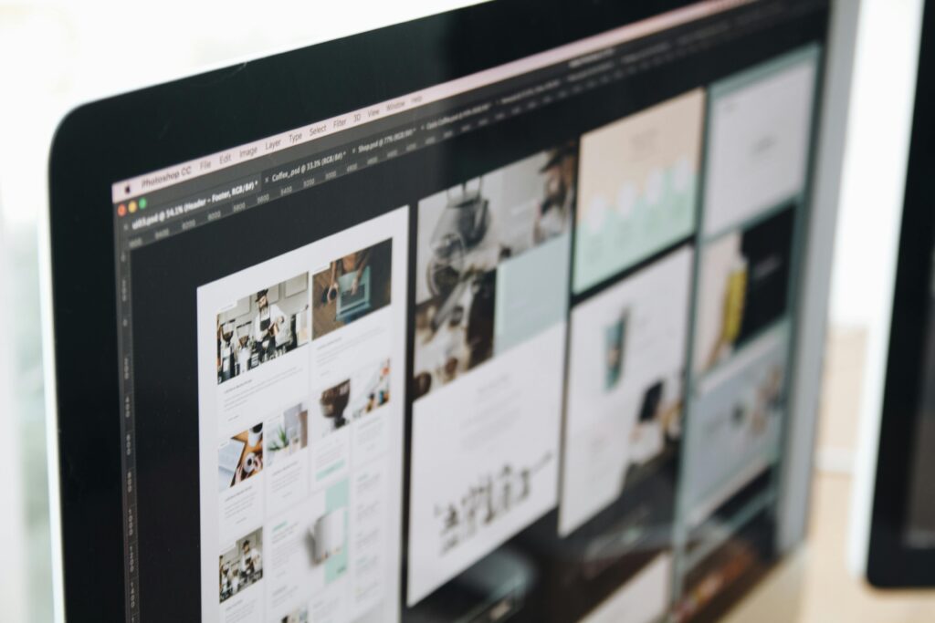 A computer screen showing different modern website designs being created.