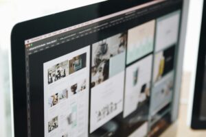 A computer screen showing different modern website designs being created.